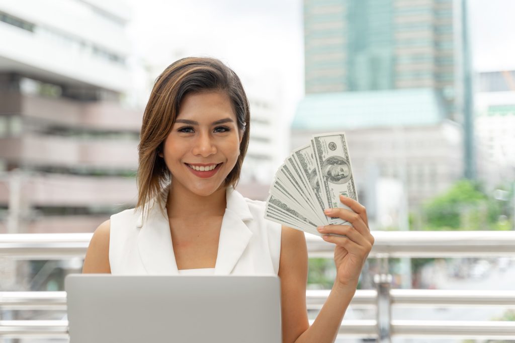 Beautiful Girl Smiling Business Woman Clothes Using Laptop Computer Show Money Us Dollar Bills Hand Scaled