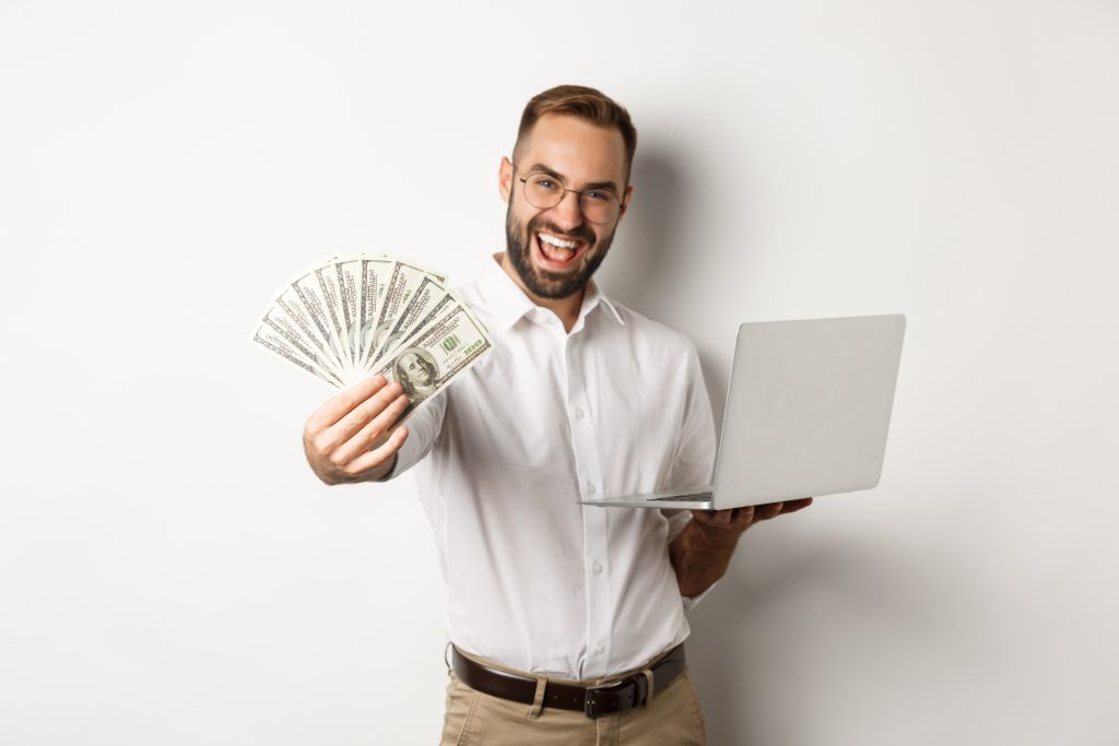 Business E Commerce Happy Successful Businessman Bragging With Money Working Laptop Online Standing Scaled